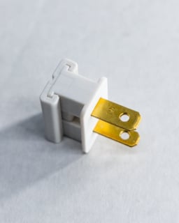 High-quality electrical power plug for lighting fixtures and electrical connections.