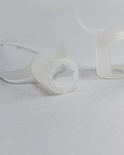 1. Clear plastic safety cable locks for electrical lighting fixtures.