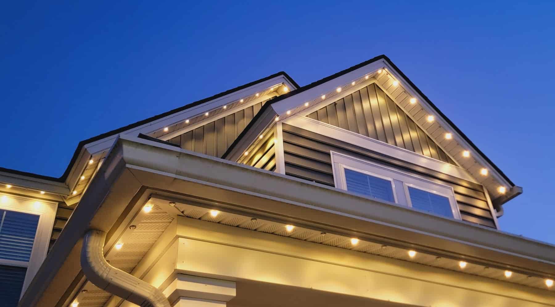 Elegant house exterior illuminated by LED lighting, showcasing outdoor lighting solutions from Thunder Lighting Supply.