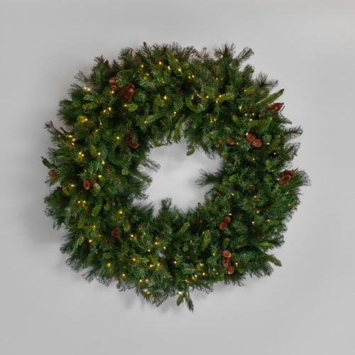 1. Festive Christmas wreath with lights and pinecones for holiday decoration.