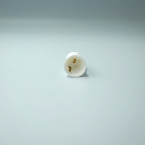 White LED light bulb socket connector for lighting fixtures and electrical wiring | LED bulb socket connector, lighting fixture wiring, electrical component for lighting installations | Close-up of a white LED light bulb socket connector used in lighting fixtures, ideal for electrical wiring and lighting projects, available at Thunder Lighting Supply.
