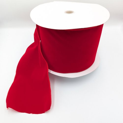Red Christmas ribbon on white background.