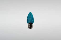 Colorful LED Christmas light bulb, holiday lighting decor, energy-efficient holiday string light.